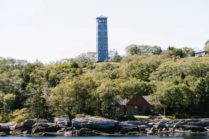 a body of water with a city in the background