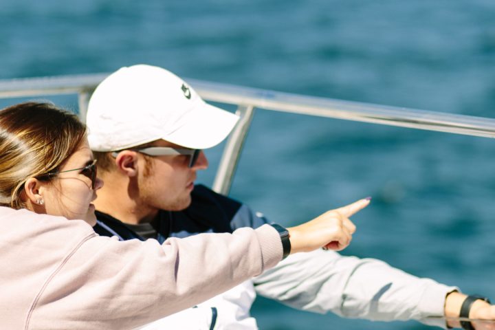 Kid pointing at something on a Boothbay Harbor fireworks cruise
