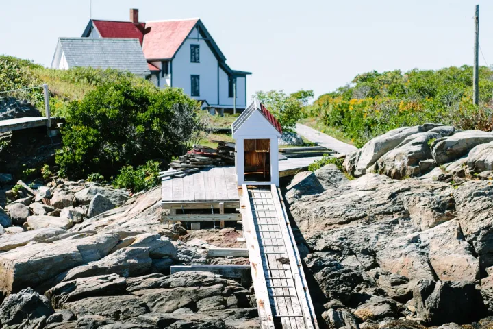 staircase up to a building near a lighthouse seen on a boothbay lighthouses & islands cruise