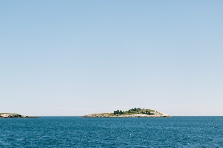 an island in the distance seen on the bold coasta